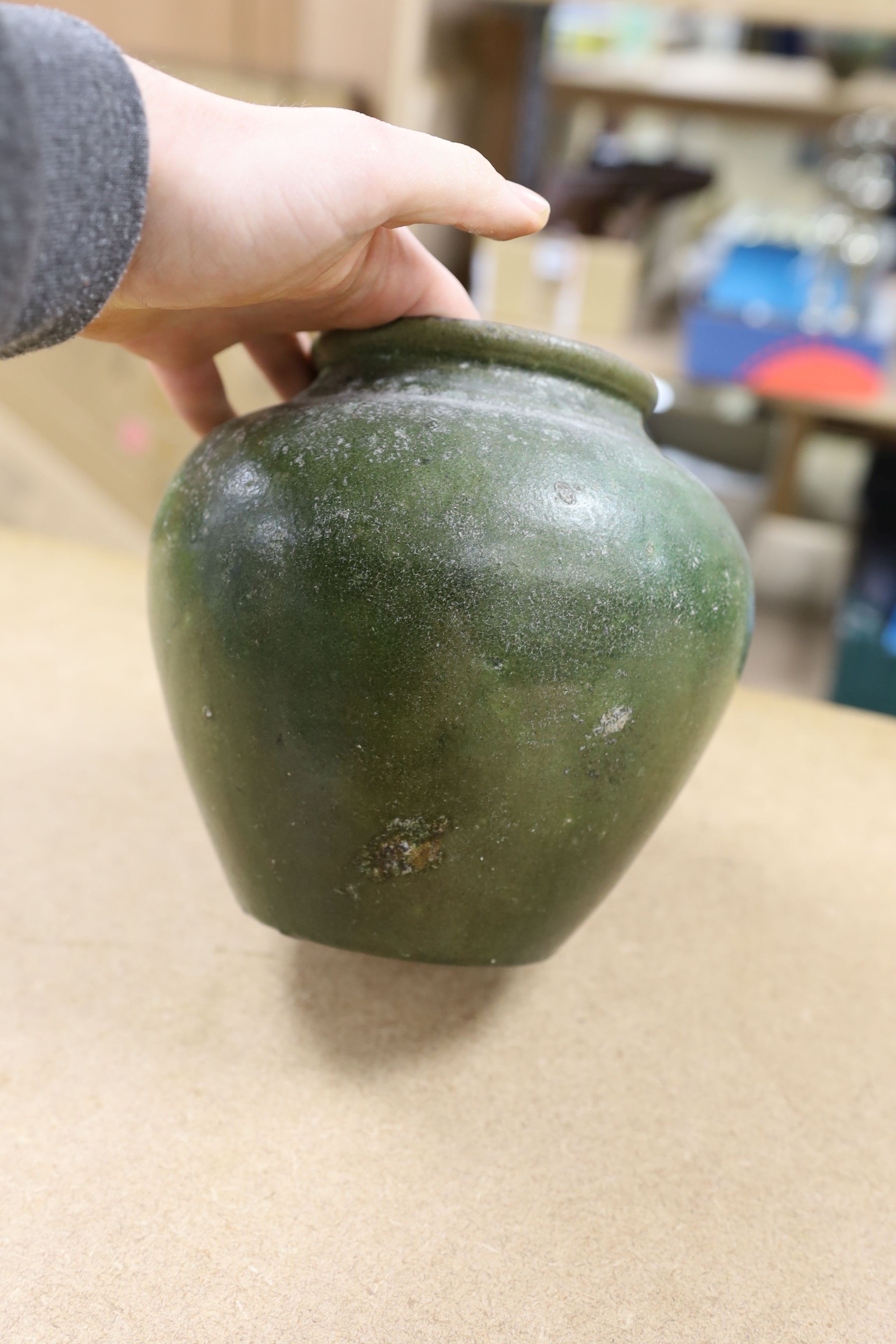 A copper lustre and green glazed pottery jar, 17.5cm high